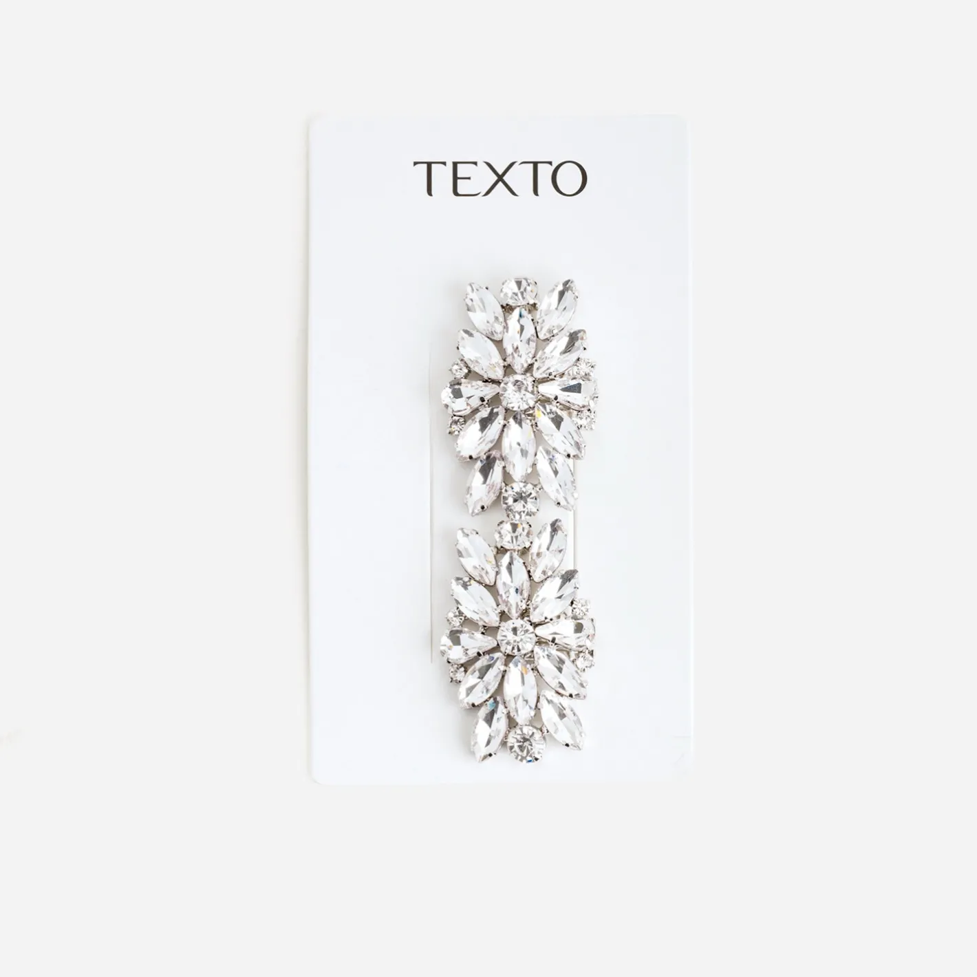 Clips gris amovibles en strass^Texto