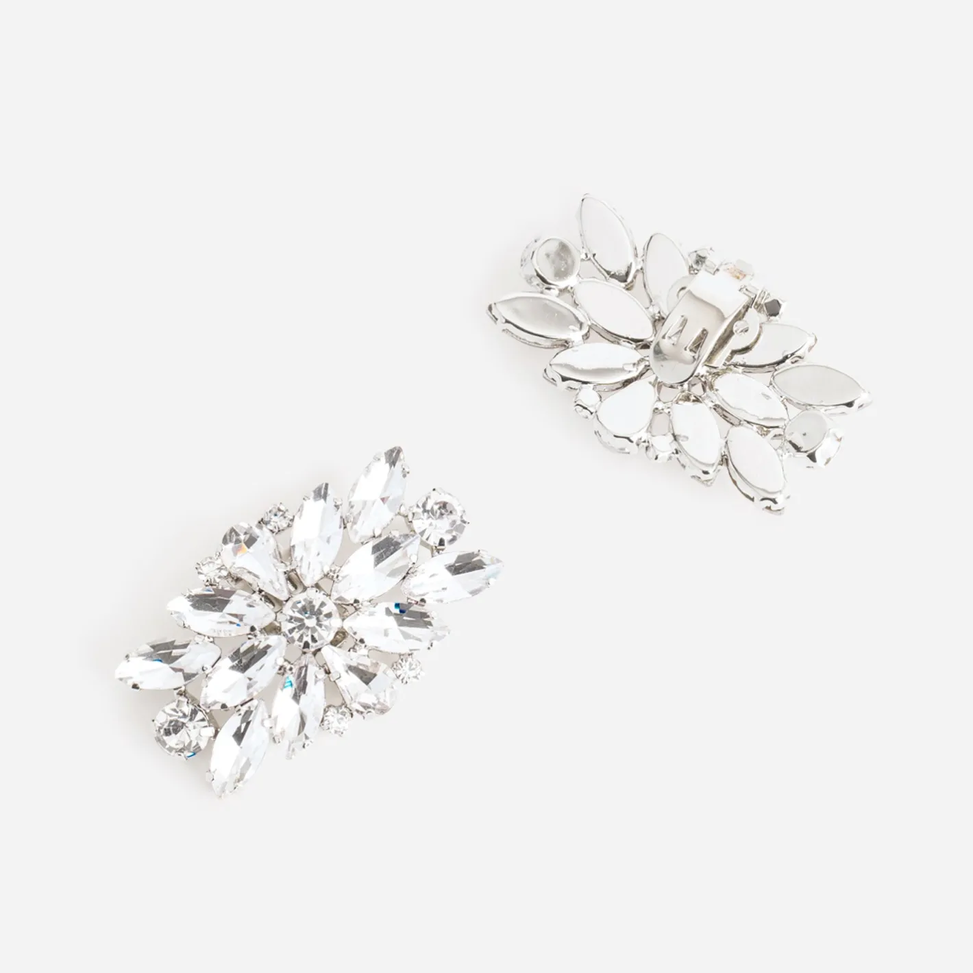 Clips gris amovibles en strass^Texto
